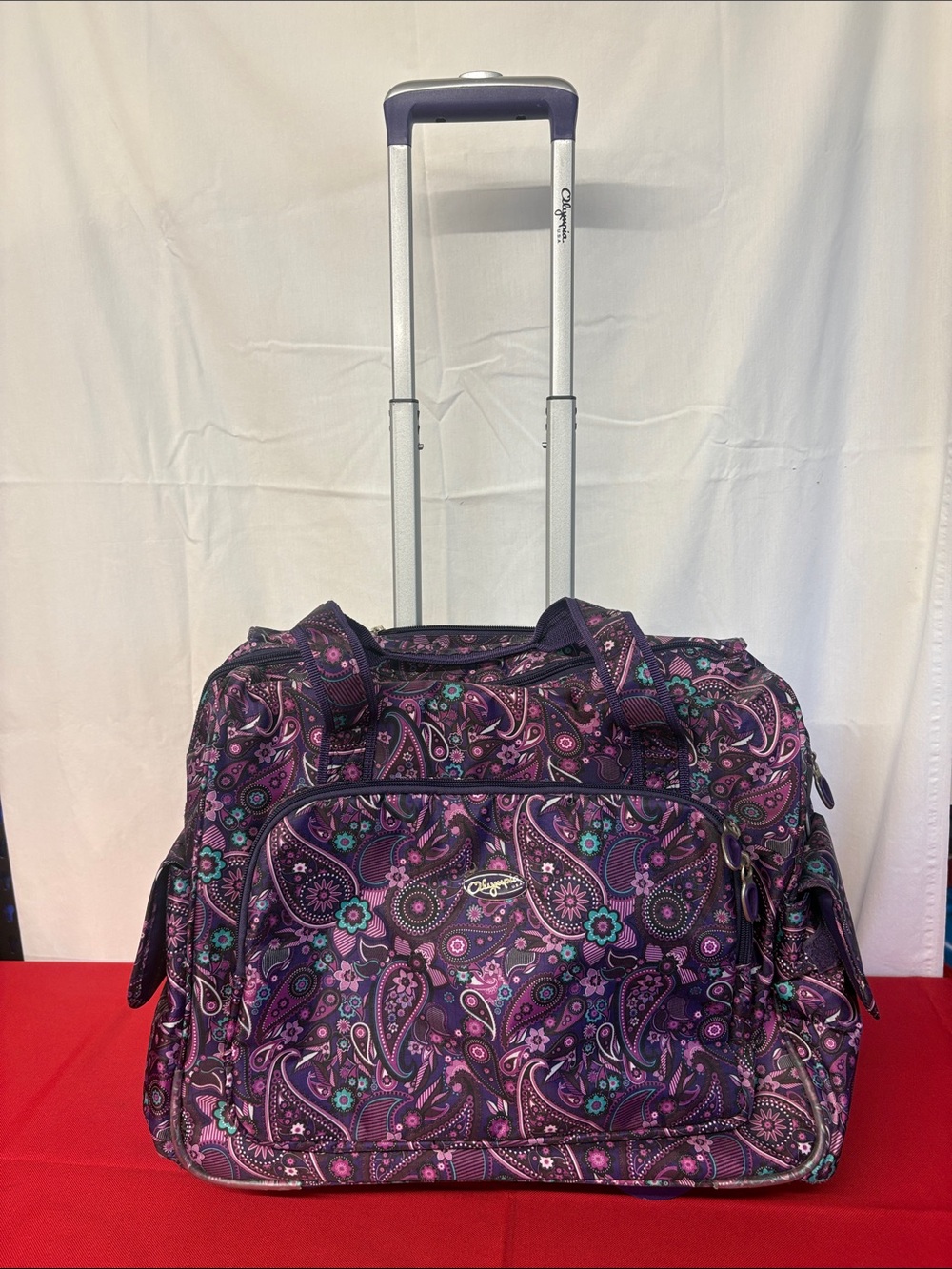 Olympia Deluxe Fashion Rolling Overnighter Luggage Suitcase, Purple Paisley